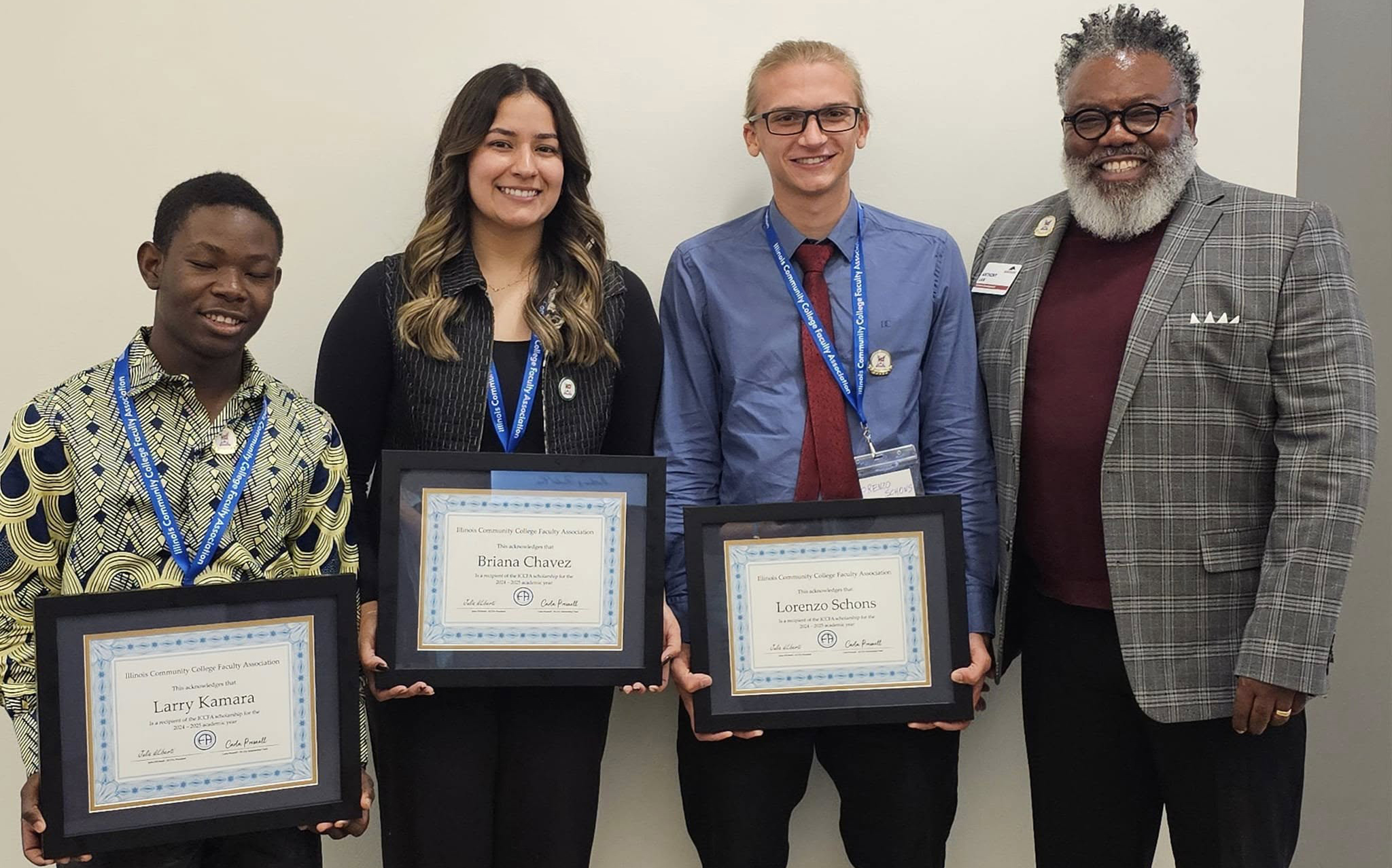 Students holding ICCFA scholarship award certificates