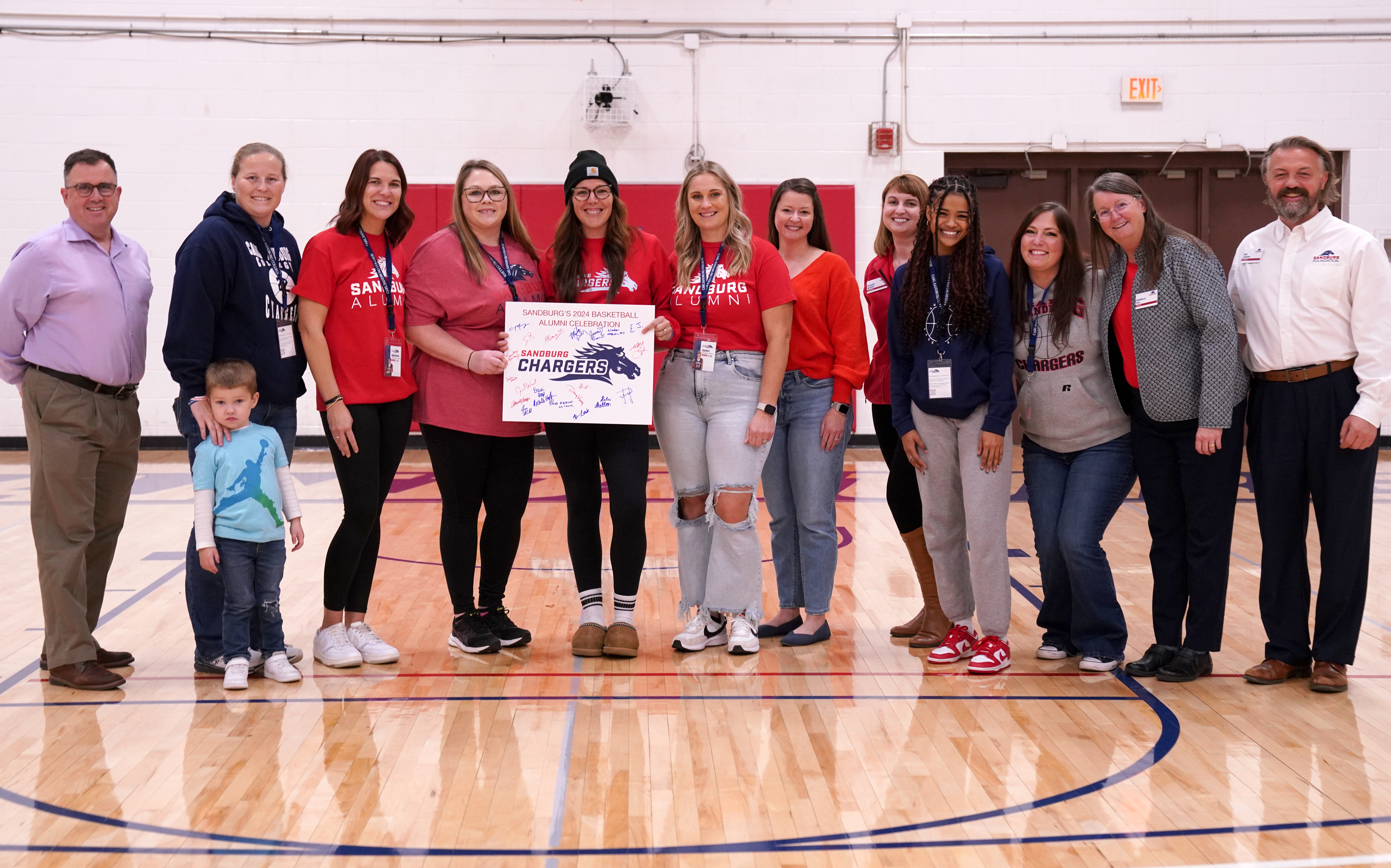 Group photo of women's basketball alumni reunion