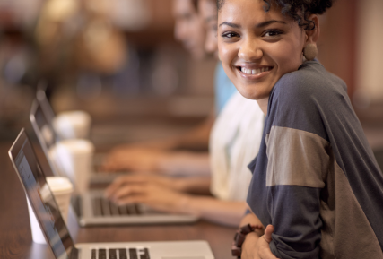 Girl sitting in front of laptop