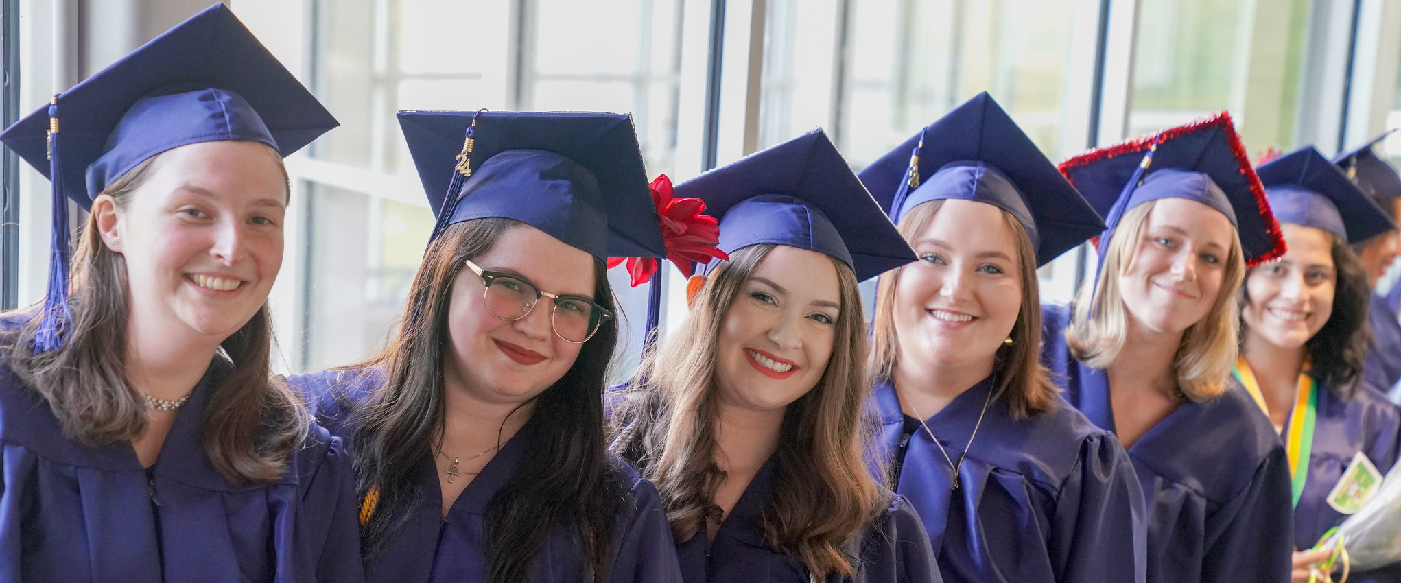 gradutates-in-a-row-women-header.jpeg