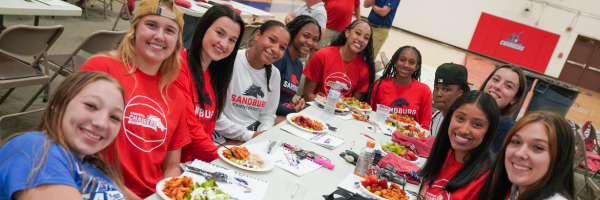 students smiling during lunch