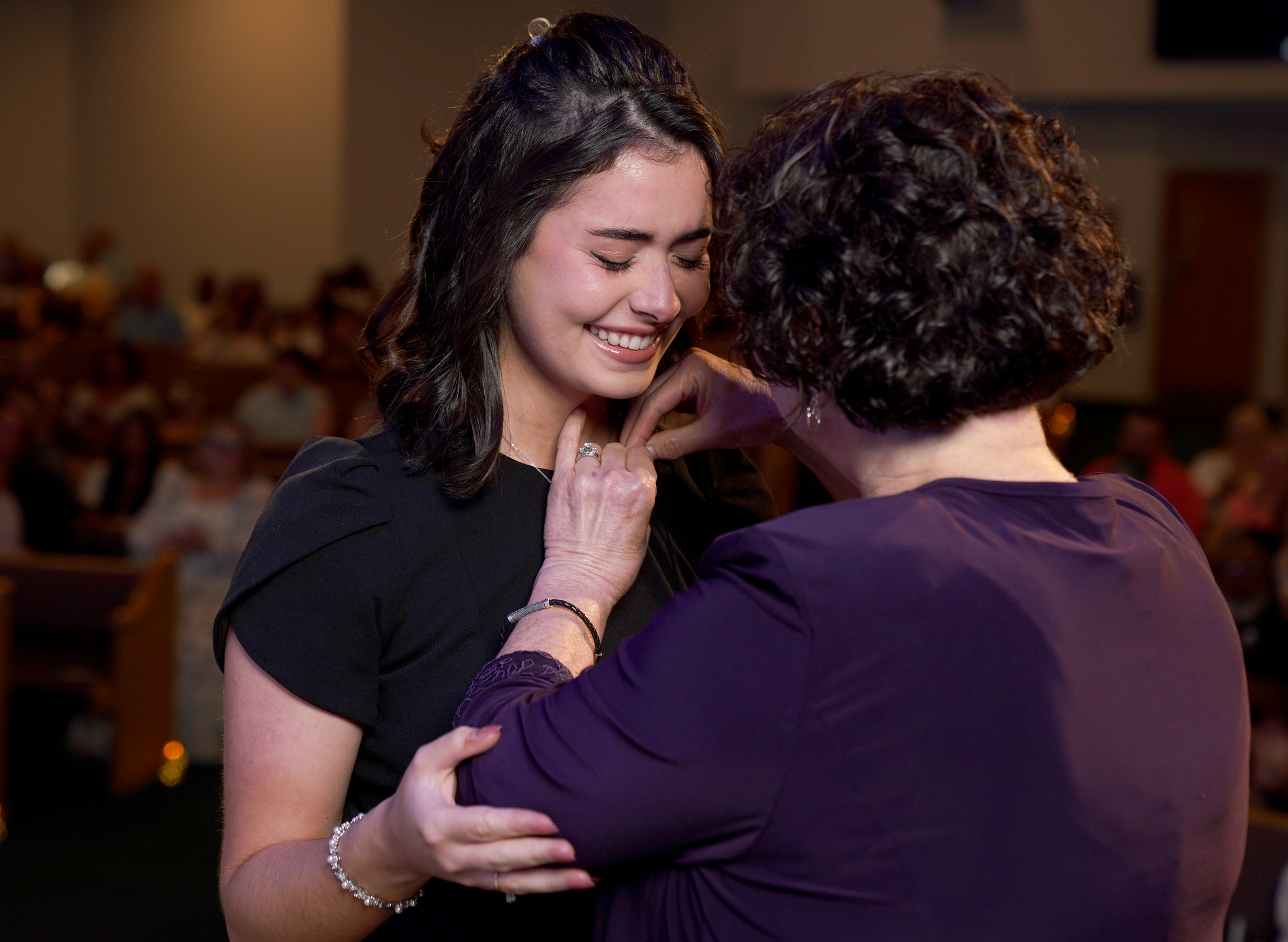 Woman receiving her nurses pin.