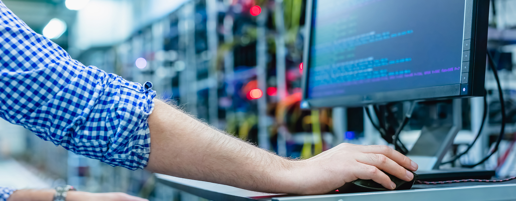 person working on a terminal on a data center.