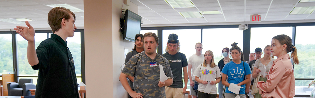 group of student on a campus tour in the library.