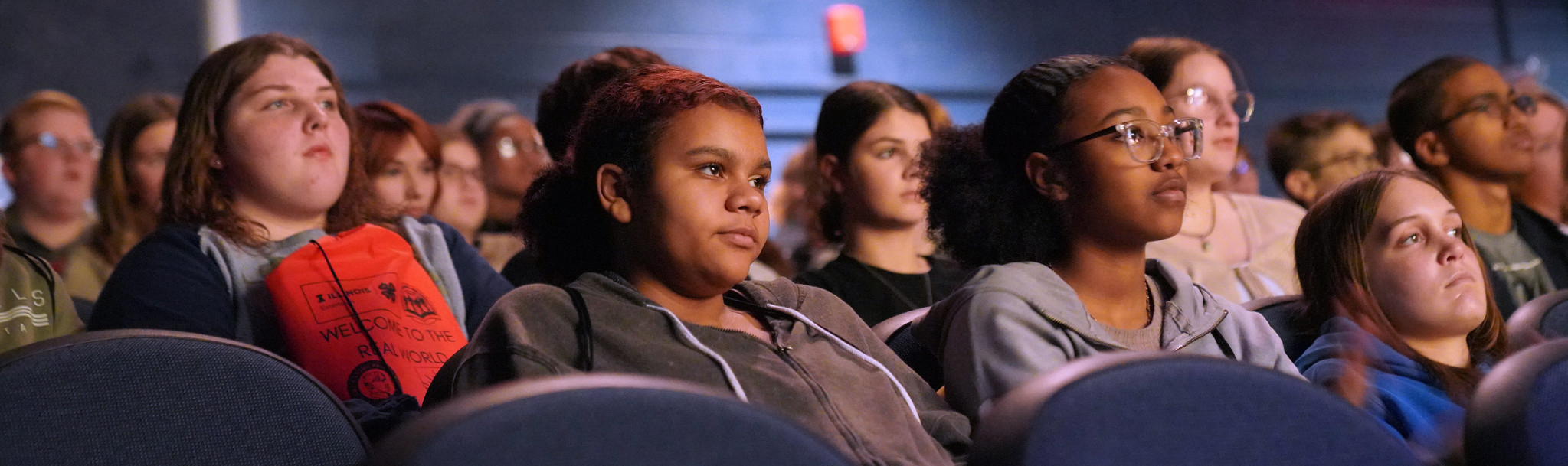 student sitting in theatre