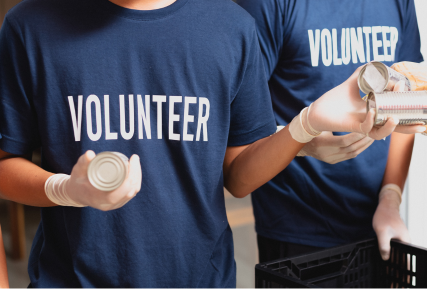 A person wearing a volunteer T-shirt